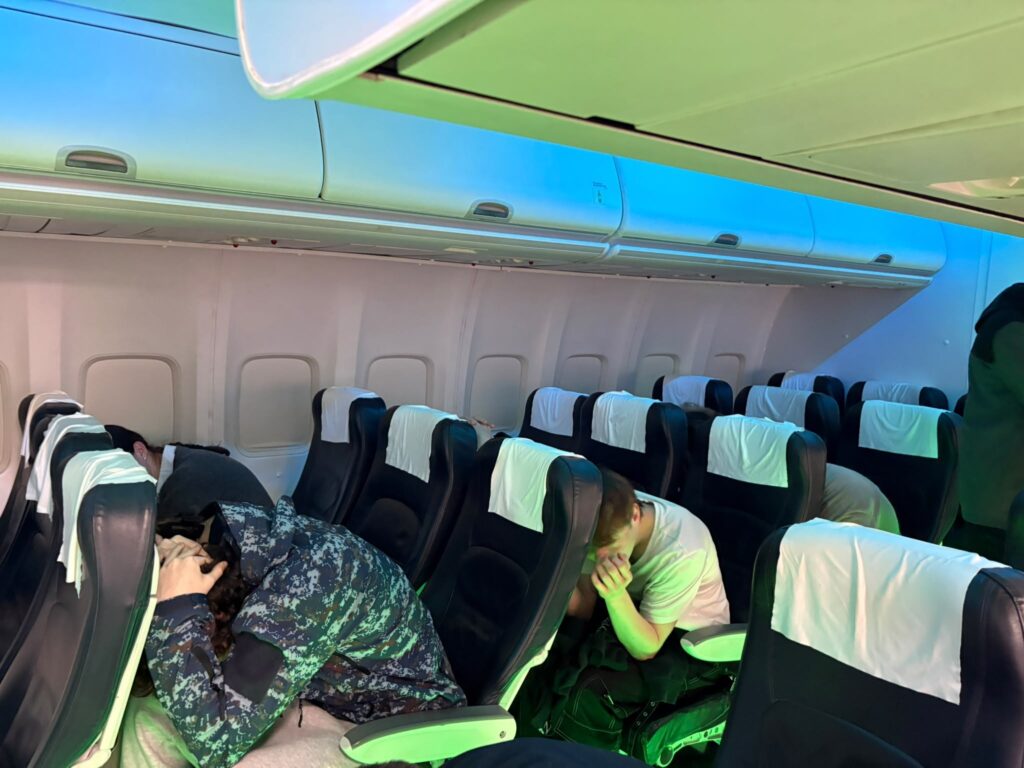Students in the cabin practising the brace position.